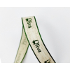 Fettuccia di lino panna con scritta "Oliva"e bordino verde, altezza 15 mm, lunghezza 20 metri