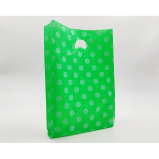 Shopper in plastica HDPE verde con fantasia "Pois" bianchi, maniglia fustellata a fagiolo, confezione da 5 kg.