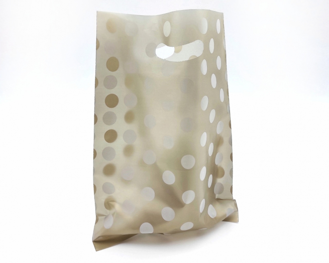 Shopper in plastica HDPE oro con fantasia "Pois" bianchi, maniglia fustellata a fagiolo, confezione da 5 kg.