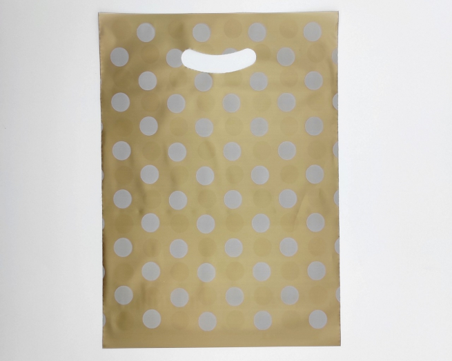 Shopper in plastica HDPE oro con fantasia "Pois" bianchi, maniglia fustellata a fagiolo, confezione da 5 kg.