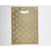 Shopper in plastica HDPE oro con fantasia "Pois" bianchi, maniglia fustellata a fagiolo, confezione da 5 kg.