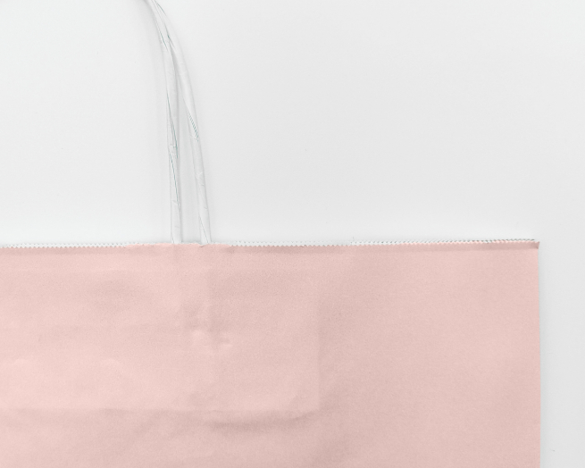 Shopper rosa antico in carta kraft con maniglia ritorta bianca